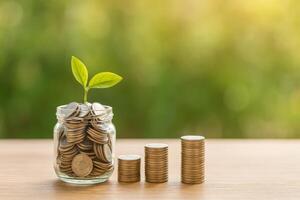 Growth of Savings With Coins in a Jar and Stacks Representing Financial Progress photo