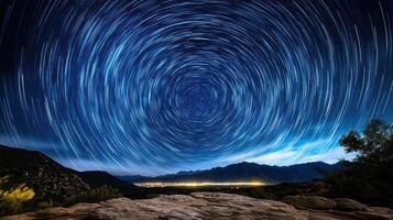 Star trails over mountains and rocks photo