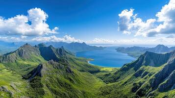 The view from a mountain overlooking a lake and mountains photo