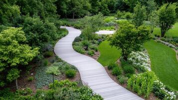 An aerial view of a garden with a wooden walkway photo