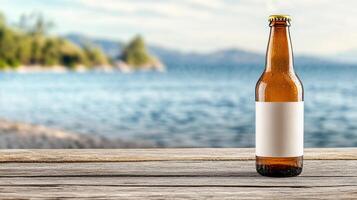 A beer bottle on a wooden table with a lake in the background photo