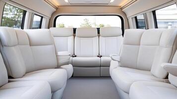 The interior of a van with white leather seats photo