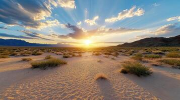 Sunset over the desert with sand dunes and mountains photo