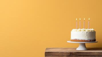 A cake with candles on top of a wooden table photo