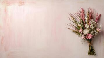 A bouquet of flowers on a pink background photo
