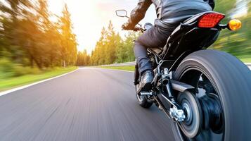 A person riding a motorcycle on a road photo