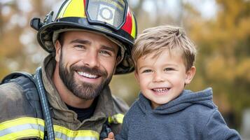 A smiling firefighter and a young boy photo