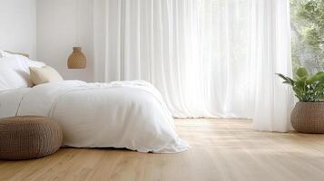 A clean bedroom with white walls and wooden floors photo