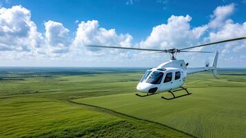 Helicopter flying over a green field photo