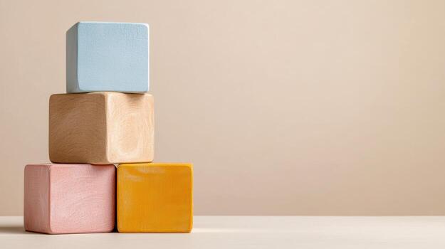 Colorful wooden blocks stacked on a table photo
