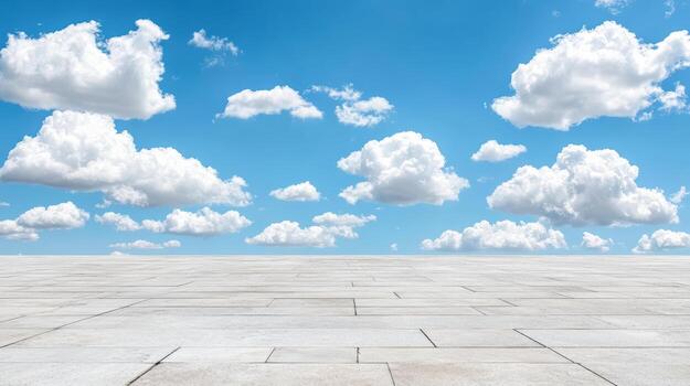 An empty concrete floor with blue sky and clouds photo