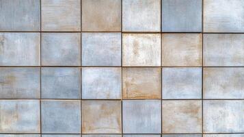 A wall made of metal tiles with a blue and white color scheme photo