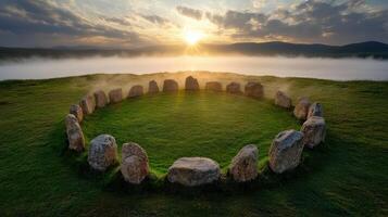 A circle of stones in the middle of a grassy field photo