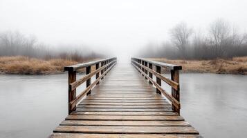 A bridge over a river in the fog photo