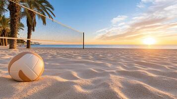 A volleyball ball on the beach at sunset photo