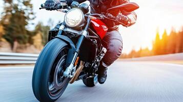 A man in a helmet riding a motorcycle on a road photo