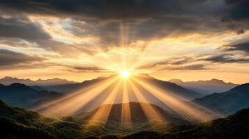 Sunrise over mountains with rays of light photo