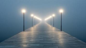 A long pier with lights on it in the fog photo