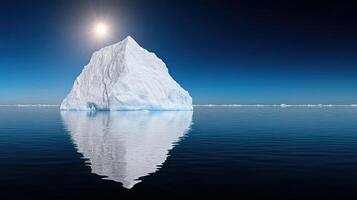 Iceberg with sun in the background photo