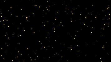 Yellow glowing sparkle particles isolated on a black background, horizontal composition. Loop animation footage for graphic design. video