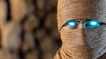 A man in a burlap cloth with glowing eyes photo