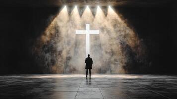 A person standing in front of a cross photo