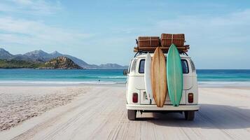 A van with surfboards on top of it's back on the beach photo