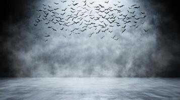 A dark room with a lot of bats flying in the air photo