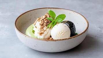 A bowl of ice cream with a spoon and a spoon photo