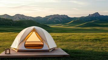 A tent on a wooden platform in a field photo