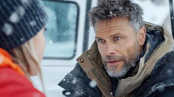 A man and woman in the snow photo