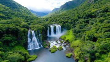 A beautiful waterfall in the middle of a lush green valley photo