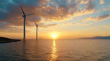 Wind turbines in the ocean at sunset photo
