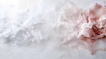 White and pink smoke on a white surface photo