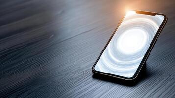 An iphone on a wooden table with a bright light shining on it photo