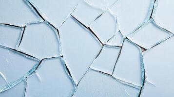 Broken glass with cracks on a white surface photo