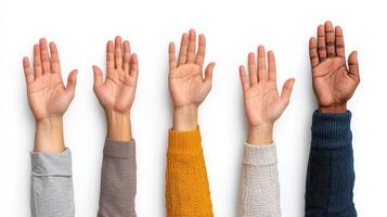 A group of people raising their hands in the air photo