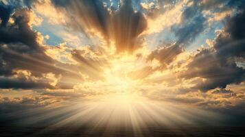 Sunbeams shining through clouds over the ocean photo