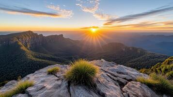 The sun rises over the blue mountains in australia photo