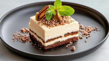 A piece of cake on a black plate photo