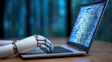 A robot hand is typing on a laptop computer photo