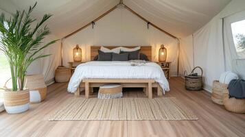 A bedroom with a bed, a rug and a table photo