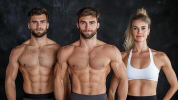 Three shirtless men and a woman posing for a photo