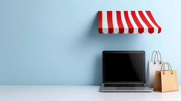 Laptop and shopping bags on a blue table with a red and white awning photo