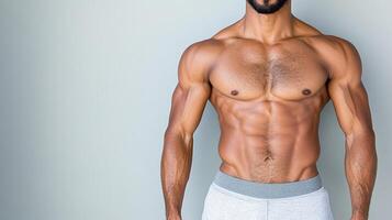 A man in underwear standing with his hands on his hips photo