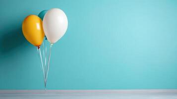 Three balloons in a room with a blue wall photo