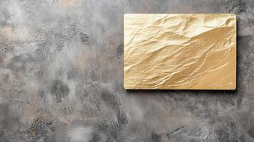 Golden square on concrete wall photo