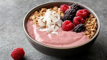 A bowl of smoothie with berries and coconut photo