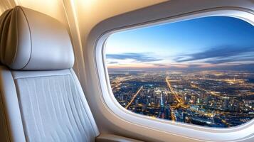 View from airplane window at night with city lights photo