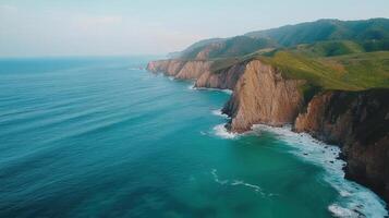 Aerial view of cliffs and ocean in the middle of the ocean photo